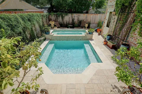a view of a backyard with sitting area