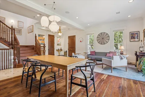a view of a dining room with furniture window and wooden floor