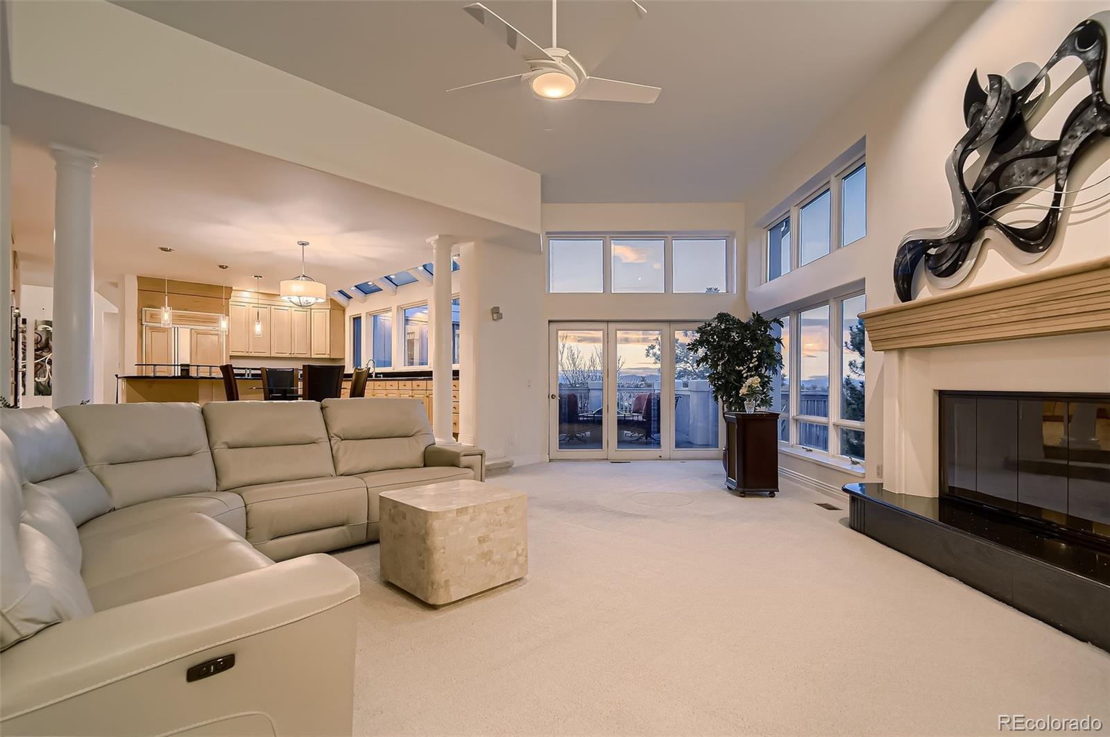 8561 Colonial Drive Lone Tree, CO 80124 - Photo 15 of 50 a living room with furniture and a fireplace