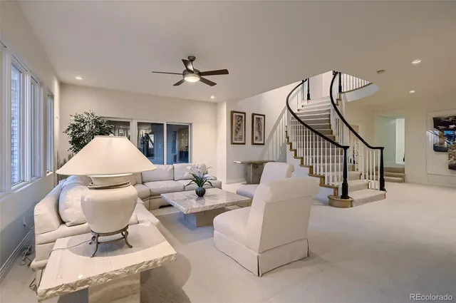 a living room with furniture and a white umbrella