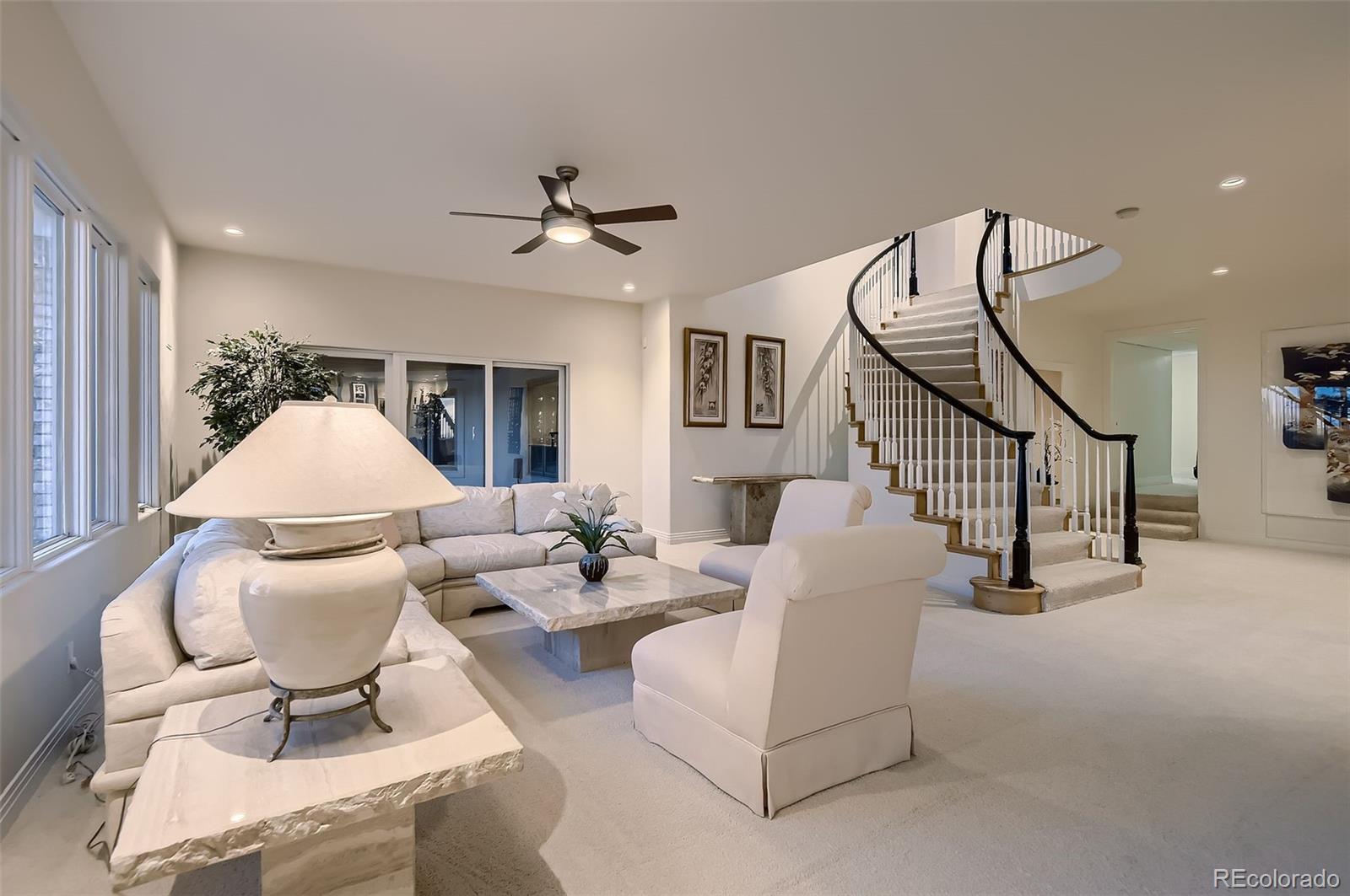 8561 Colonial Drive Lone Tree, CO 80124 - Photo 31 of 50 a living room with furniture and a white umbrella