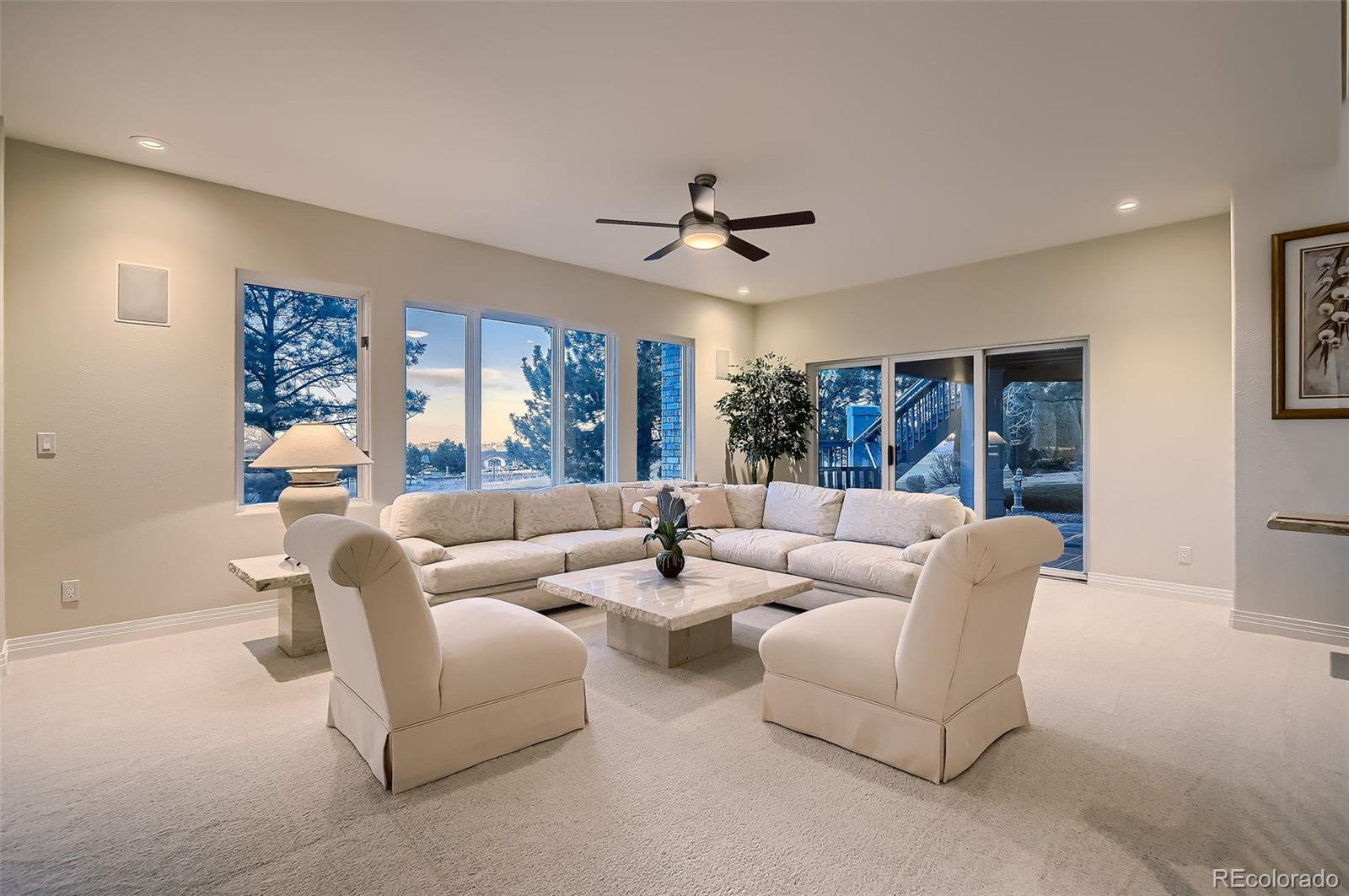 8561 Colonial Drive Lone Tree, CO 80124 - Photo 32 of 50 a living room with furniture and a large window