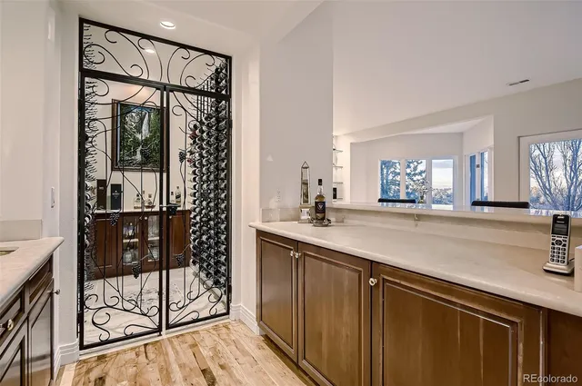 a kitchen with a sink and large window