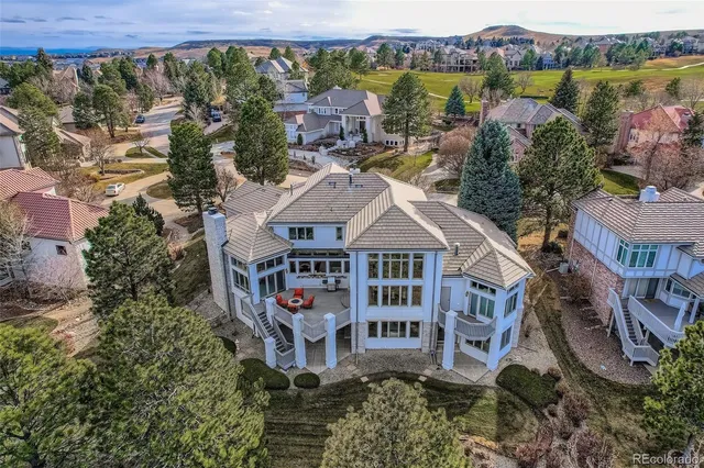 an aerial view of a house with a lake view
