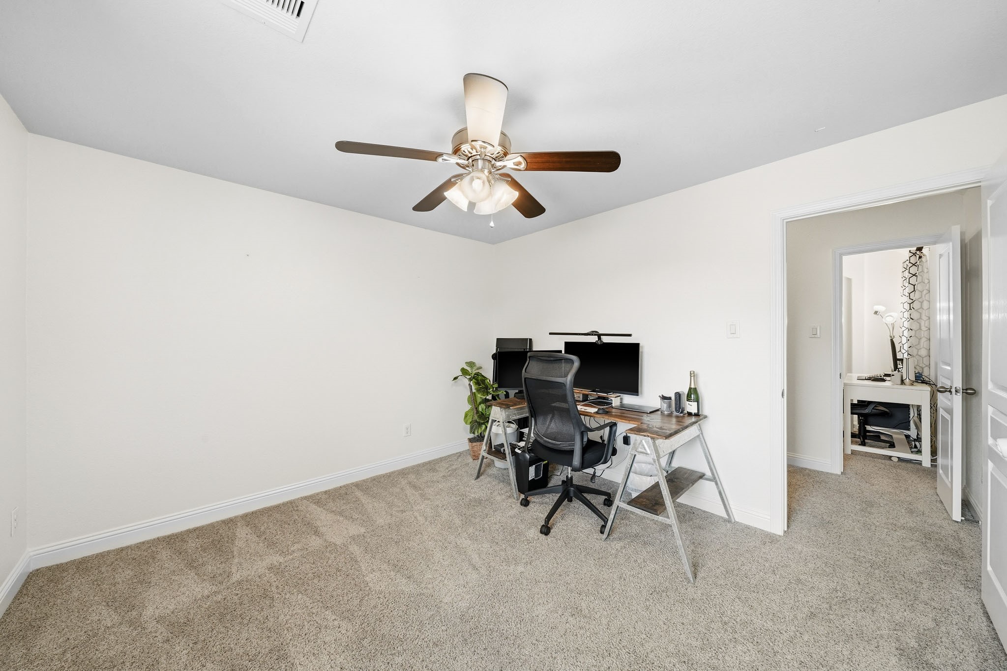 17610 Strackfield Lane Tomball, TX 77377 - Photo 41 of 50 Hidden away for added privacy, this flexible room offers a comfortable and inviting space that can easily adapt to your lifestyle, whether as a study, fitness room, library or personal lounge.