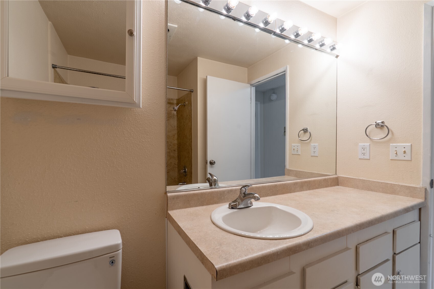 230 Southwest Clark Street, Unit C203 Issaquah, WA 98027 - Photo 13 of 22 a bathroom with a sink and a mirror