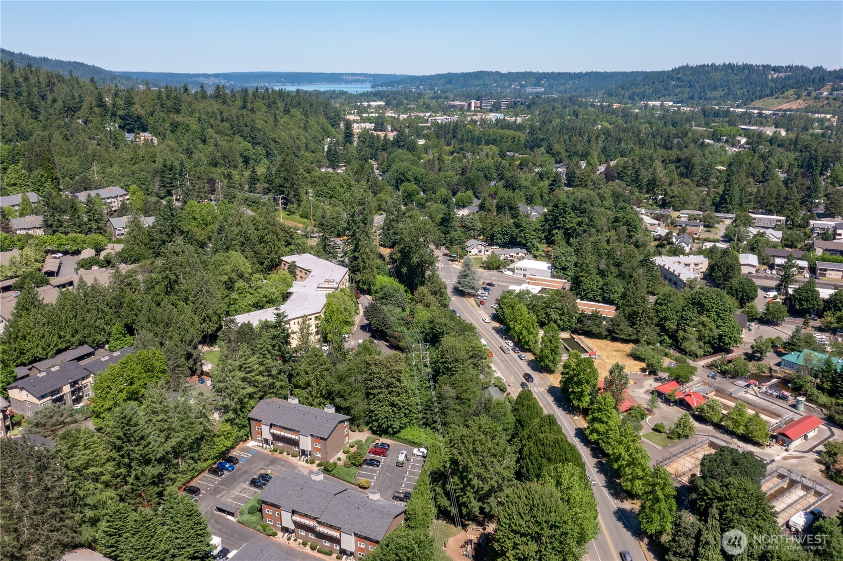 230 Southwest Clark Street, Unit C203 Issaquah, WA 98027 - Photo 15 of 22 an aerial view of a city with lots of residential buildings and mountain view in back