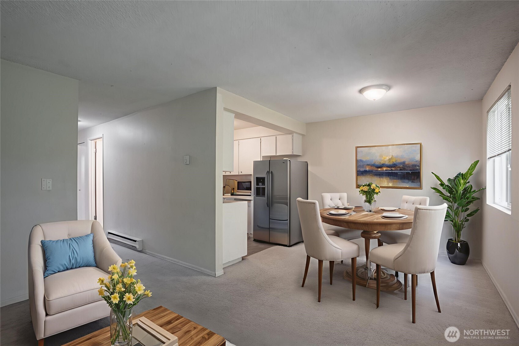 230 Southwest Clark Street, Unit C203 Issaquah, WA 98027 - Photo 4 of 22 a view of a dining room with furniture a livingroom and kitchen view