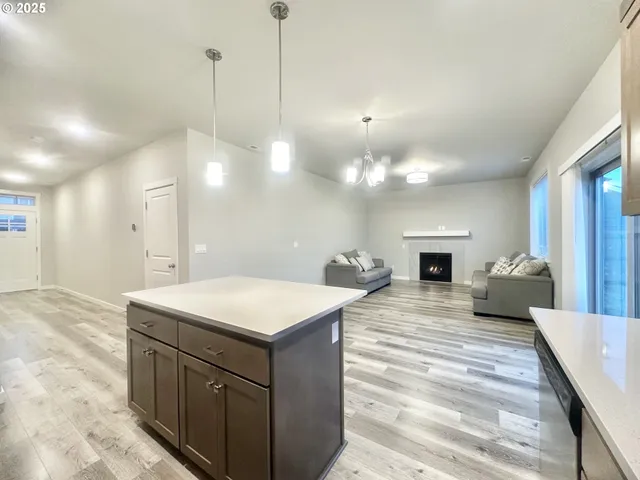 a room with a bed and a chandelier