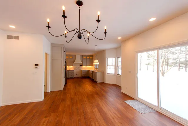 a view of a room with gym equipment and windows