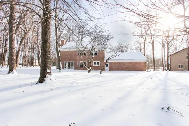 a view of a house with a street