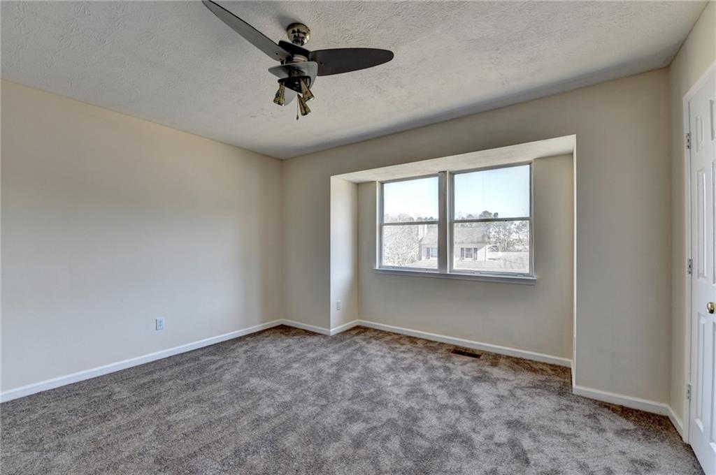 2082 Montgomery Trail Duluth, GA 30096 - Photo 38 of 45 an empty room with windows and fan