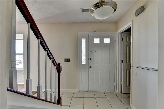 a view of an entryway with staircase
