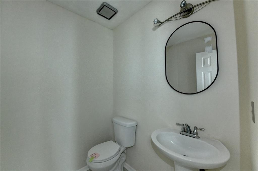 2082 Montgomery Trail Duluth, GA 30096 - Photo 6 of 45 a bathroom with a sink mirror and toilet