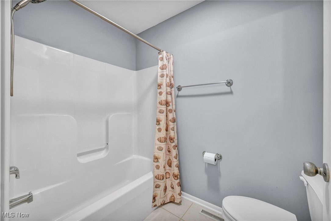 30257 Center Ridge Road Westlake, OH 44145 - Photo 33 of 42 Bathroom with shower / bath combo and tile patterned flooring