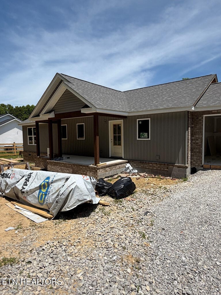 1259 Franklin Loop Clarkrange, TN 38553 - Photo 2 of 5 a front view of a house with a yard