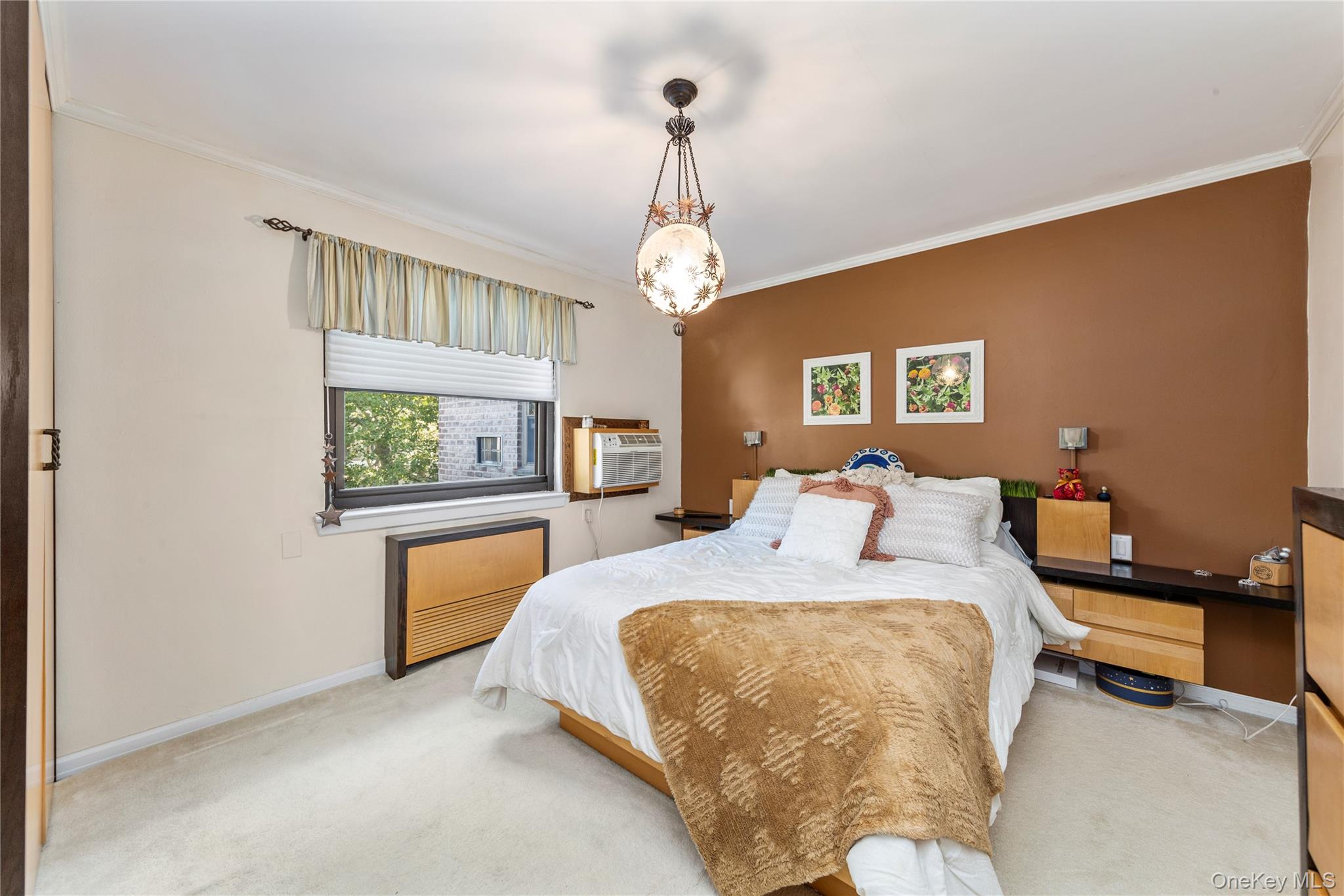 16 Terrace Circle, Unit 14C Great Neck, NY 11021 - Photo 3 of 9 Carpeted bedroom with crown molding and baseboards