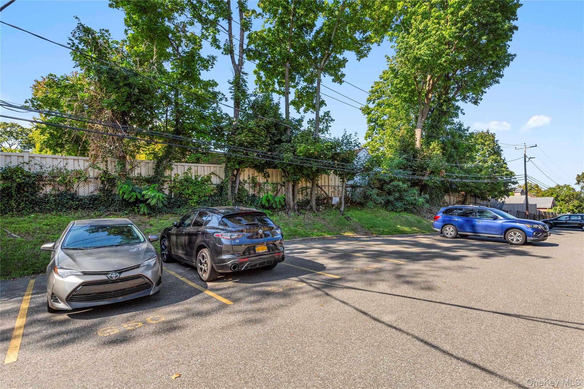 16 Terrace Circle, Unit 14C Great Neck, NY 11021 - Photo 8 of 9 View of uncovered parking lot