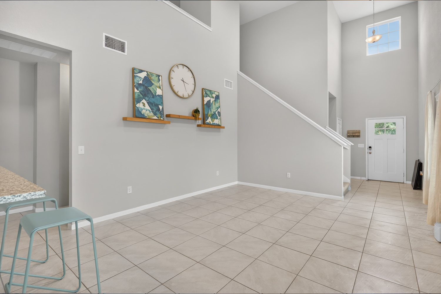 2006 Grow Lane Austin, TX 78754 - Photo 11 of 40 The soaring vaulted ceiling and large window in the entry fill this open-concept living area with light.