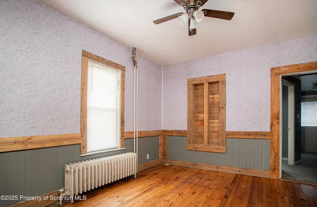 a view of an empty room and a window