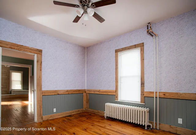 a view of cabinets and wooden floor