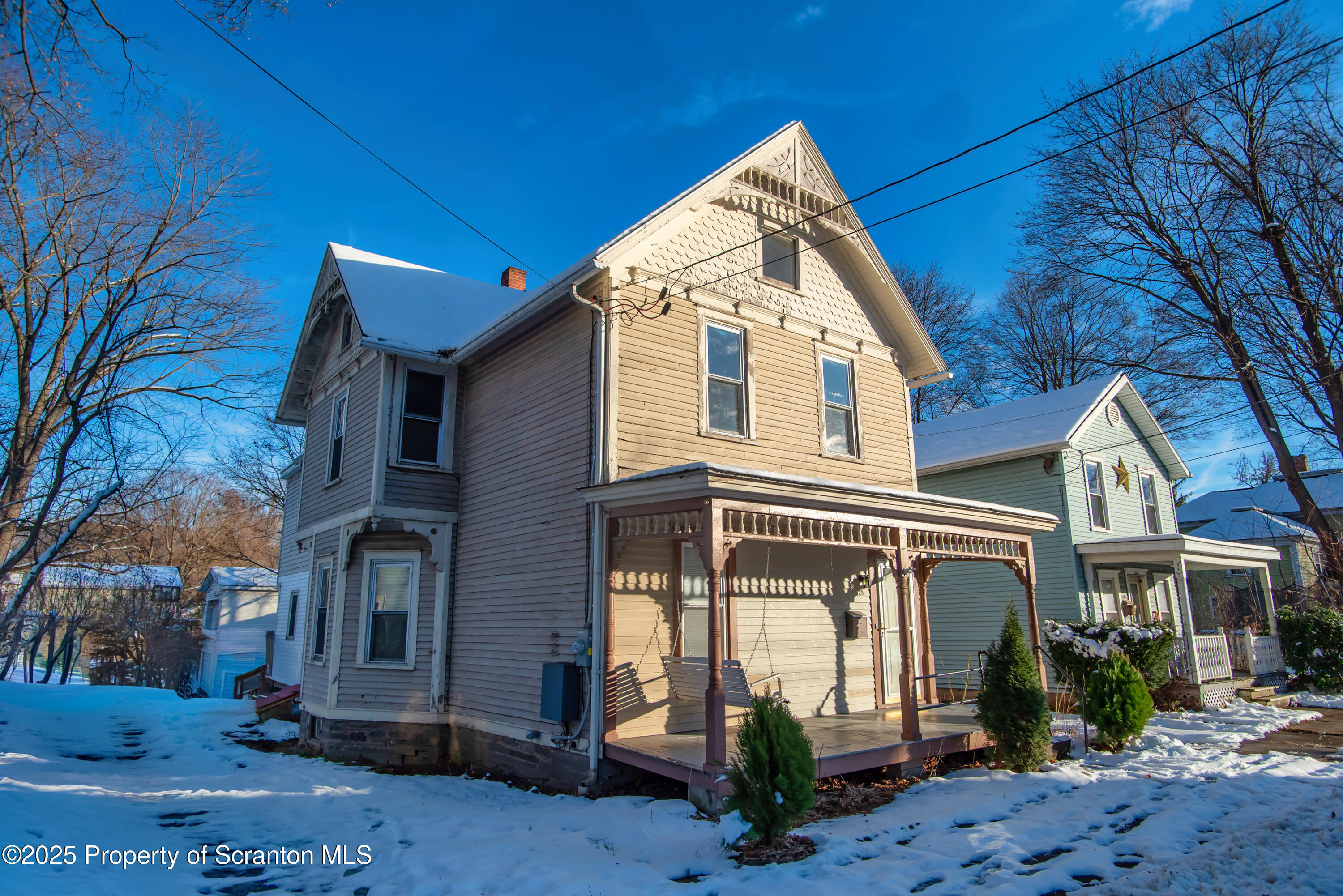 28 Pine Street Tunkhannock, PA 18657 - Photo 3 of 50 a view of a brick house with a small yard