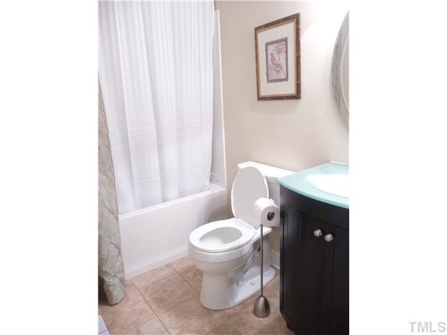 2208 Corberrie Lane Raleigh, NC 27613 - Photo 21 of 25 a bathroom with a toilet and a sink