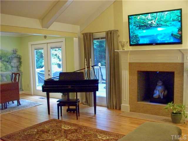 2208 Corberrie Lane Raleigh, NC 27613 - Photo 4 of 25 a view of a livingroom with furniture and a fireplace