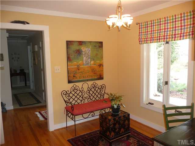 2208 Corberrie Lane Raleigh, NC 27613 - Photo 8 of 25 a living room with furniture and a chandelier