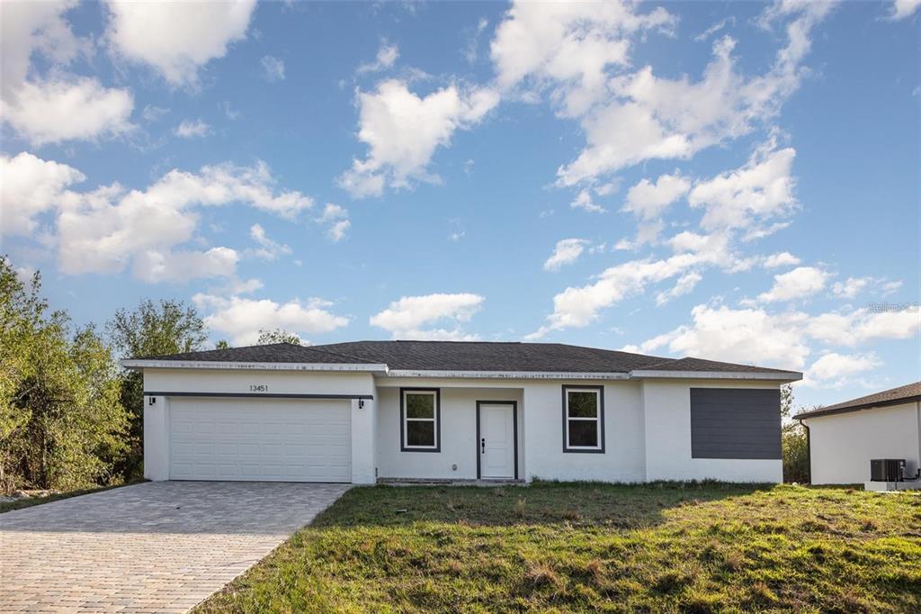 a house with trees in the background