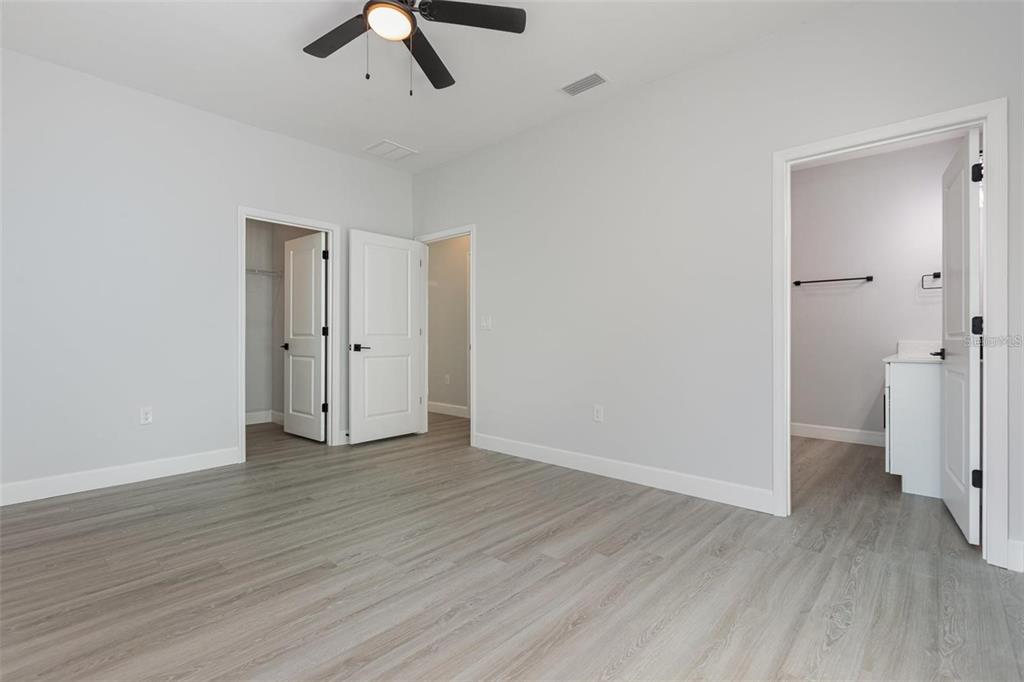 13451 Kaplan Terrace Port Charlotte, FL 33981 - Photo 11 of 27 wooden floor in an empty room