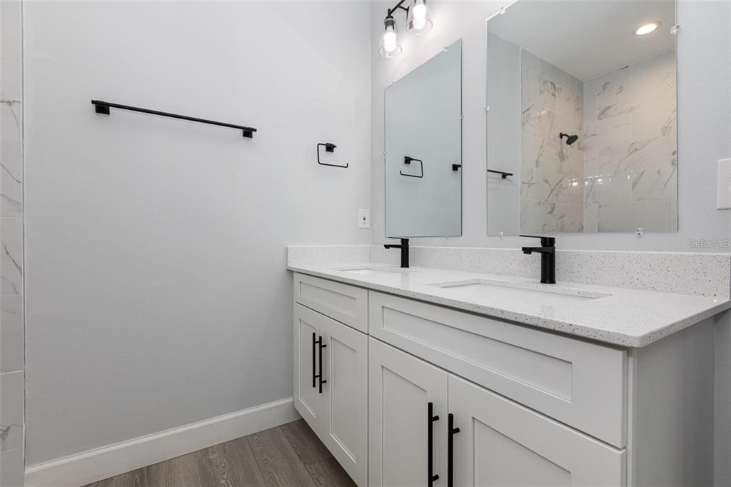 13451 Kaplan Terrace Port Charlotte, FL 33981 - Photo 12 of 27 a bathroom with a sink and a mirror