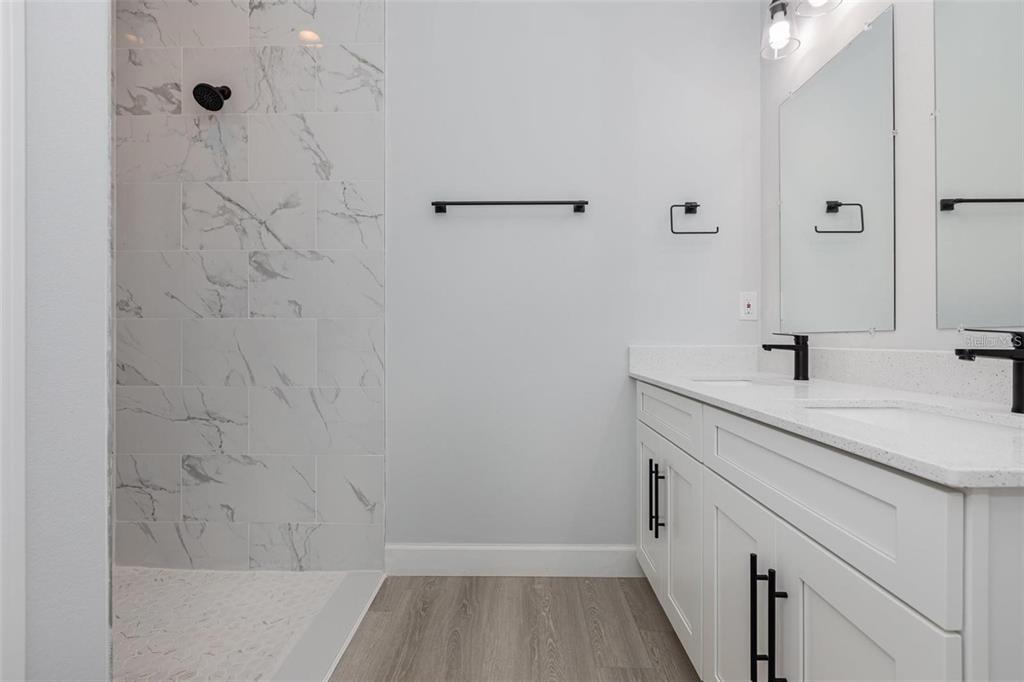 13451 Kaplan Terrace Port Charlotte, FL 33981 - Photo 13 of 27 a bathroom with a sink and a mirror