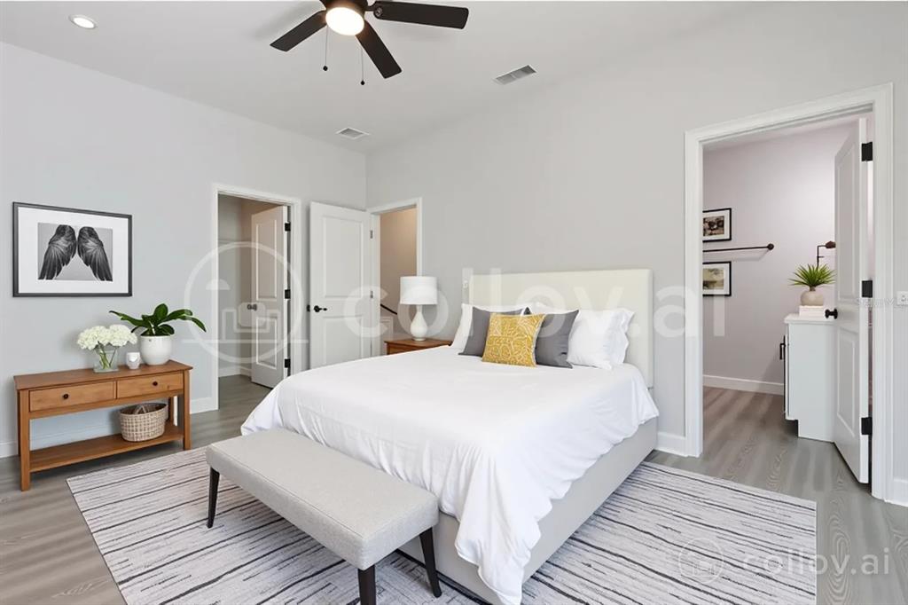 13451 Kaplan Terrace Port Charlotte, FL 33981 - Photo 26 of 27 a bedroom with a bed and wooden floor