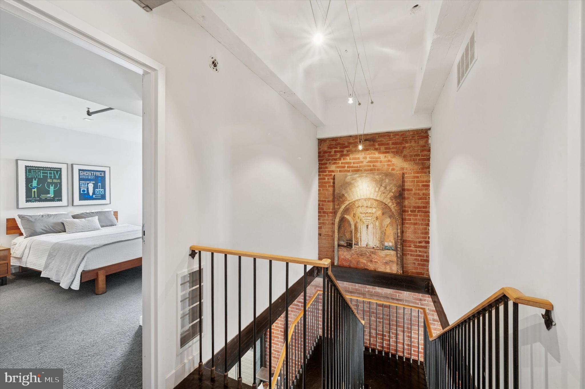 1101 Washington Avenue, Unit 306 Philadelphia, PA 19147 - Photo 14 of 25 a view of a hallway with a livingroom and furniture
