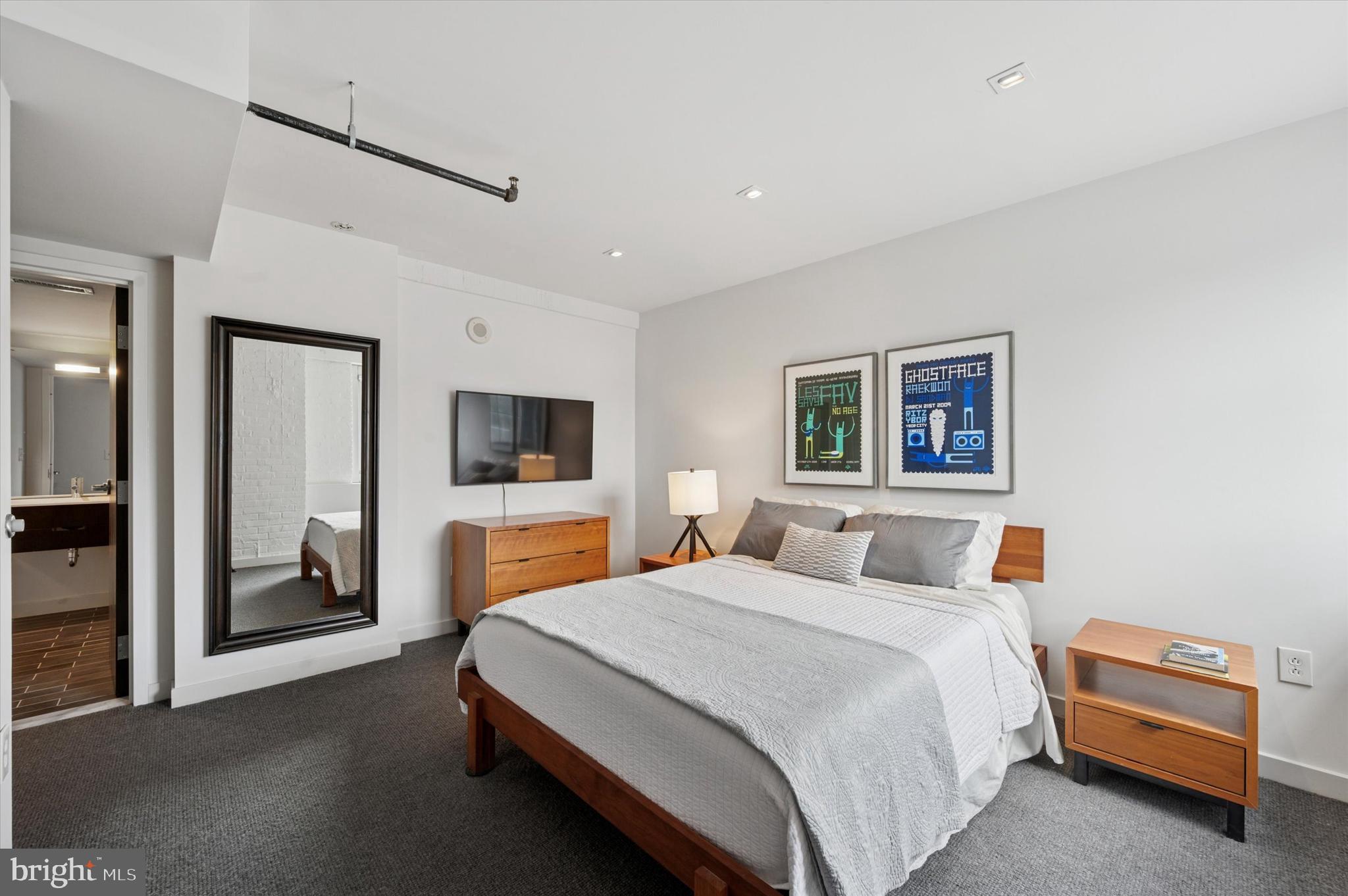 1101 Washington Avenue, Unit 306 Philadelphia, PA 19147 - Photo 21 of 25 a bedroom with a bed and a couch