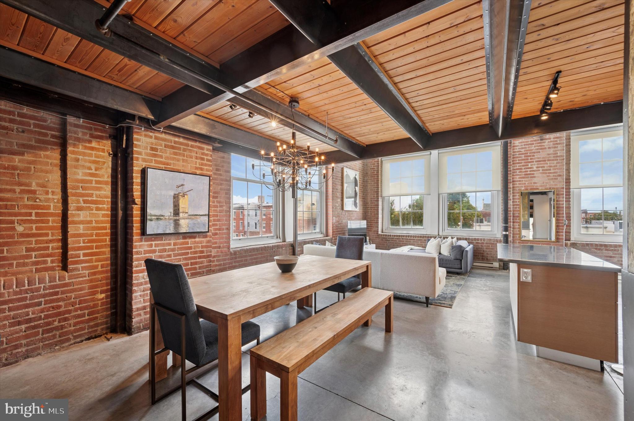 1101 Washington Avenue, Unit 306 Philadelphia, PA 19147 - Photo 6 of 25 a outdoor space with couches and large pool view