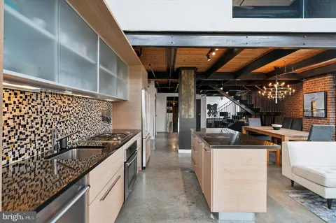 a kitchen with a sink and cabinets