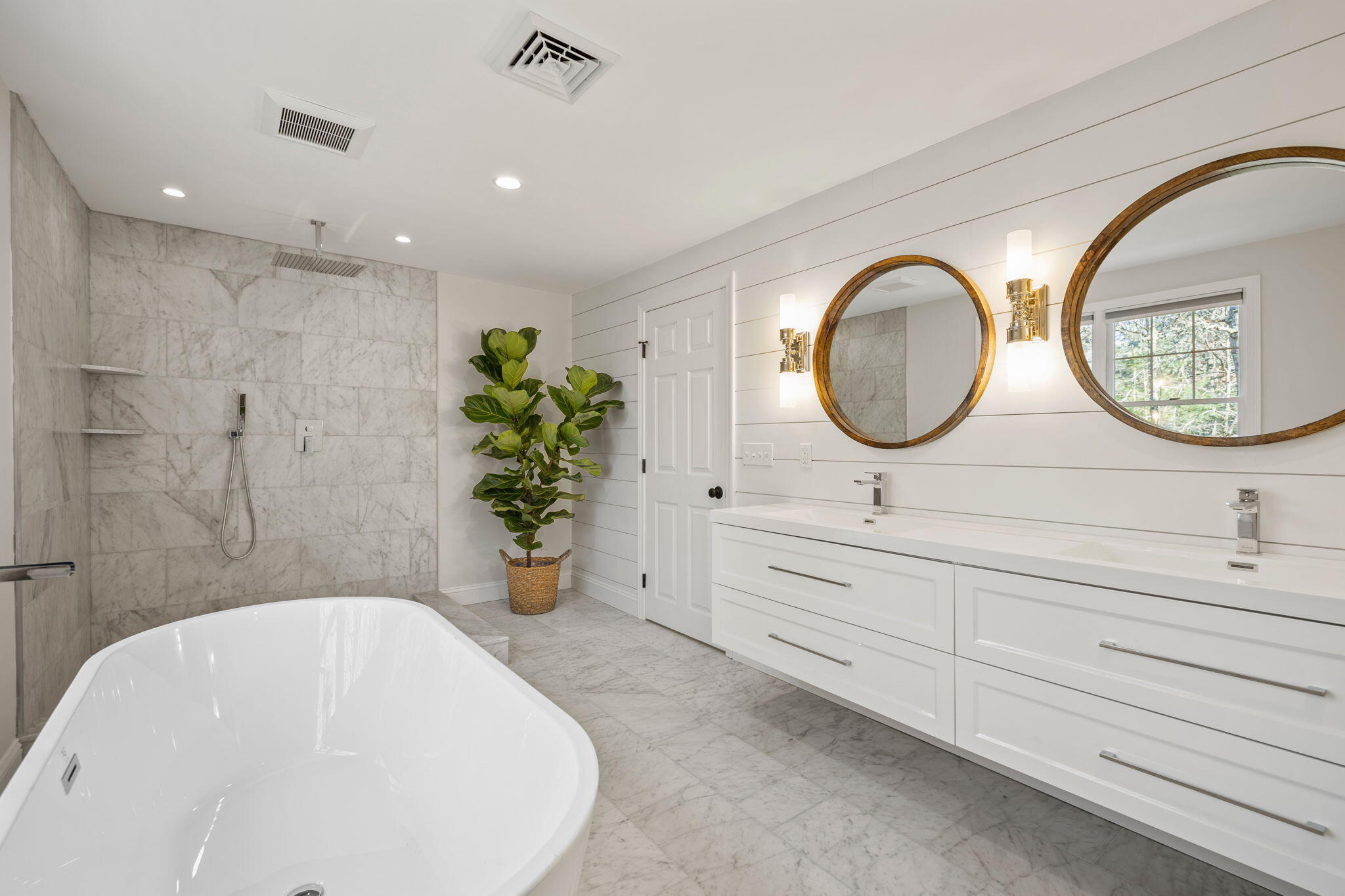 992 Bumps River Road Centerville, MA 02632 - Photo 13 of 33 a bathroom with a sink a mirror and a shower