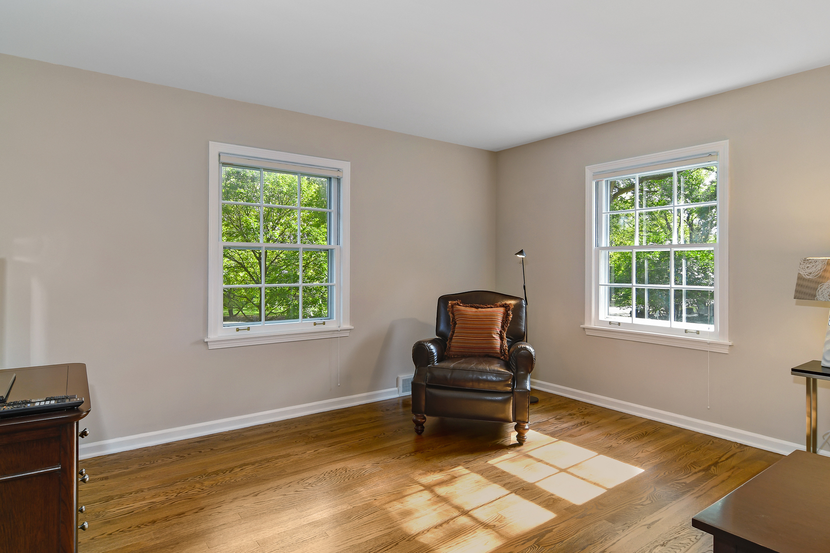 1124 Woodview Road Burr Ridge, IL 60527 - Photo 22 of 27 a living room with furniture and a window