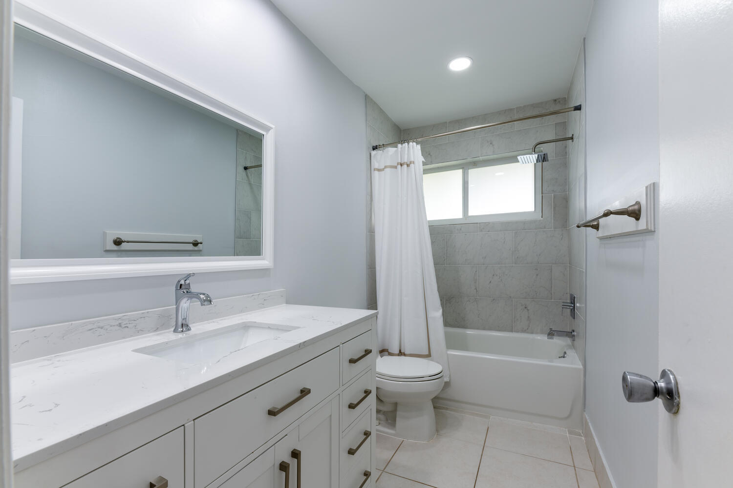 4695 Brandywine Drive Boca Raton, FL 33487 - Photo 15 of 28 a bathroom with a sink a toilet and shower