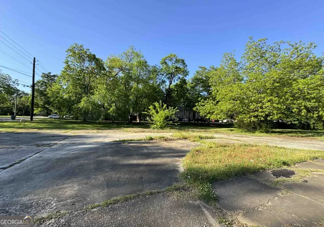 a view of a swimming pool with an outdoor space and seating area
