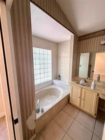 a view of a livingroom with a dishwasher and a window
