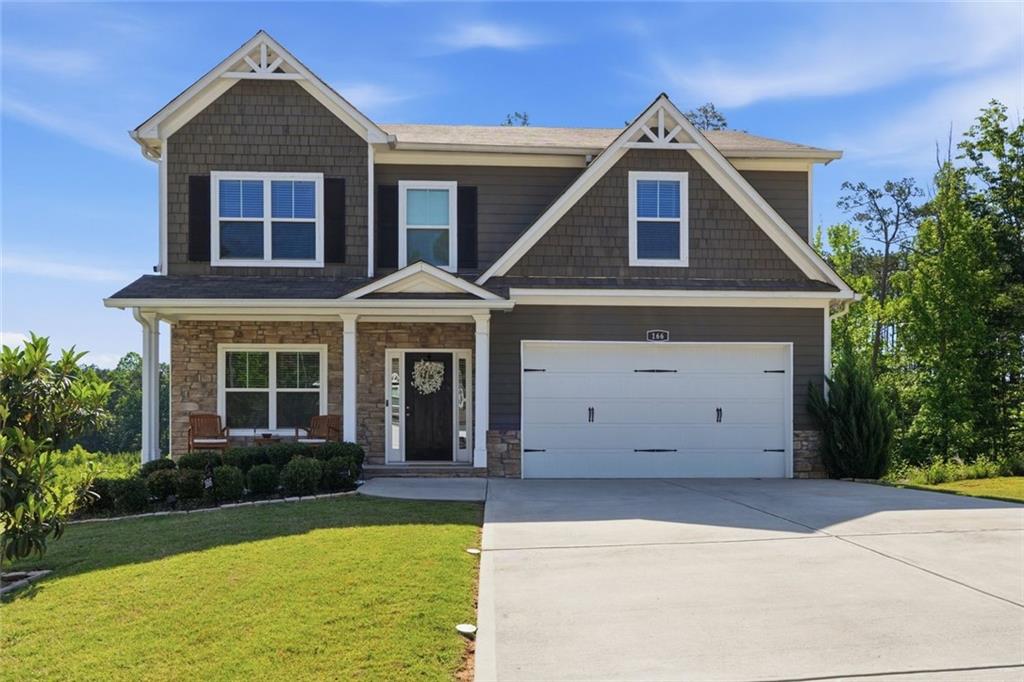 166 Ashbridge Lane Dallas, GA 30132 - Photo 1 of 35 a front view of a house with garden