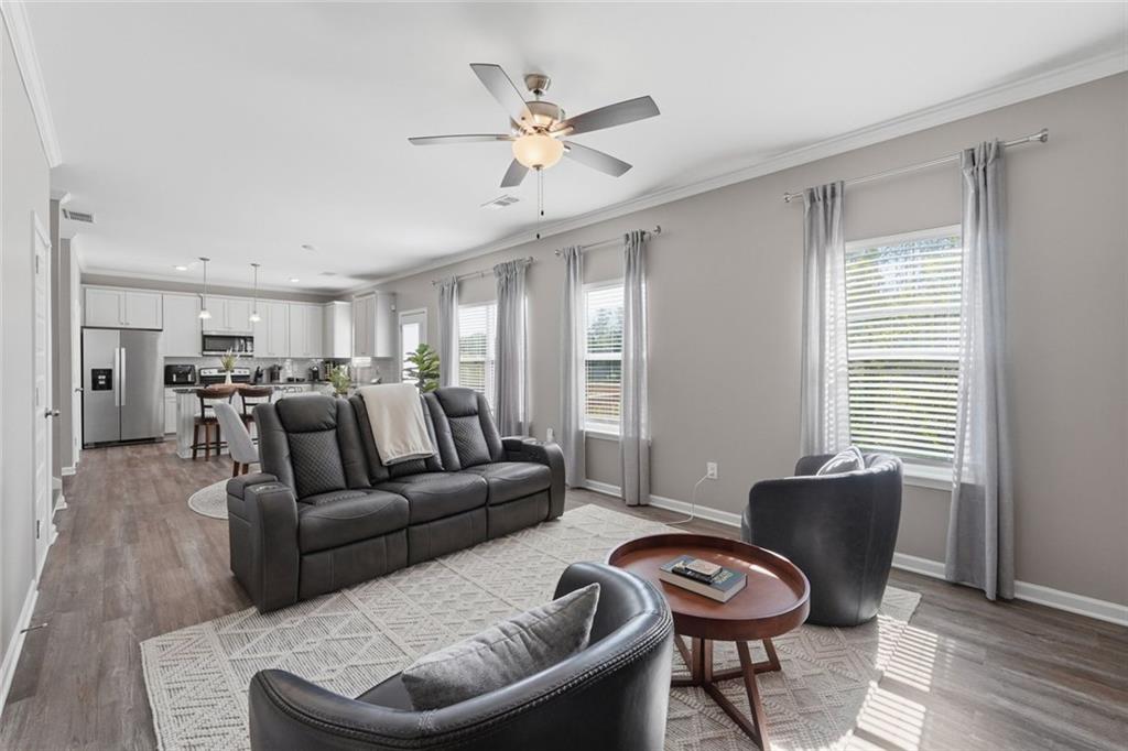 166 Ashbridge Lane Dallas, GA 30132 - Photo 12 of 35 a living room with furniture and a ceiling fan