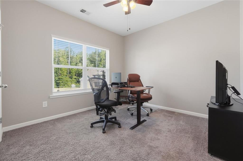 166 Ashbridge Lane Dallas, GA 30132 - Photo 13 of 35 a view of a workspace with furniture and a window