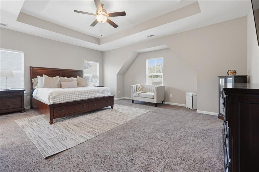 166 Ashbridge Lane Dallas, GA 30132 - Photo 18 of 35 a living room with furniture and a chandelier