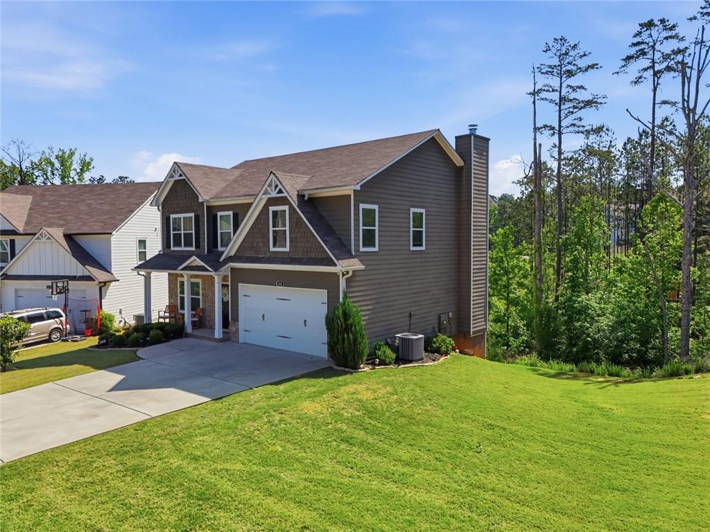 166 Ashbridge Lane Dallas, GA 30132 - Photo 2 of 35 front view of a house with a yard