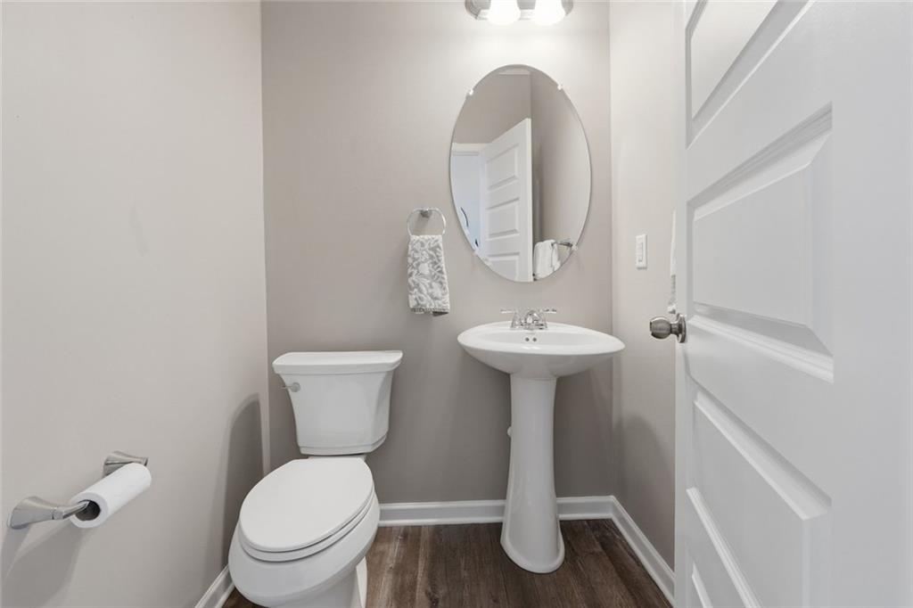 166 Ashbridge Lane Dallas, GA 30132 - Photo 23 of 35 a bathroom with a toilet sink and mirror