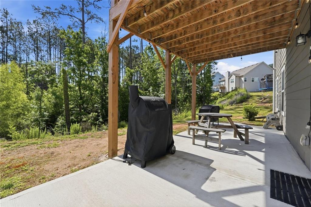 166 Ashbridge Lane Dallas, GA 30132 - Photo 27 of 35 a backyard of a house with outdoor seating